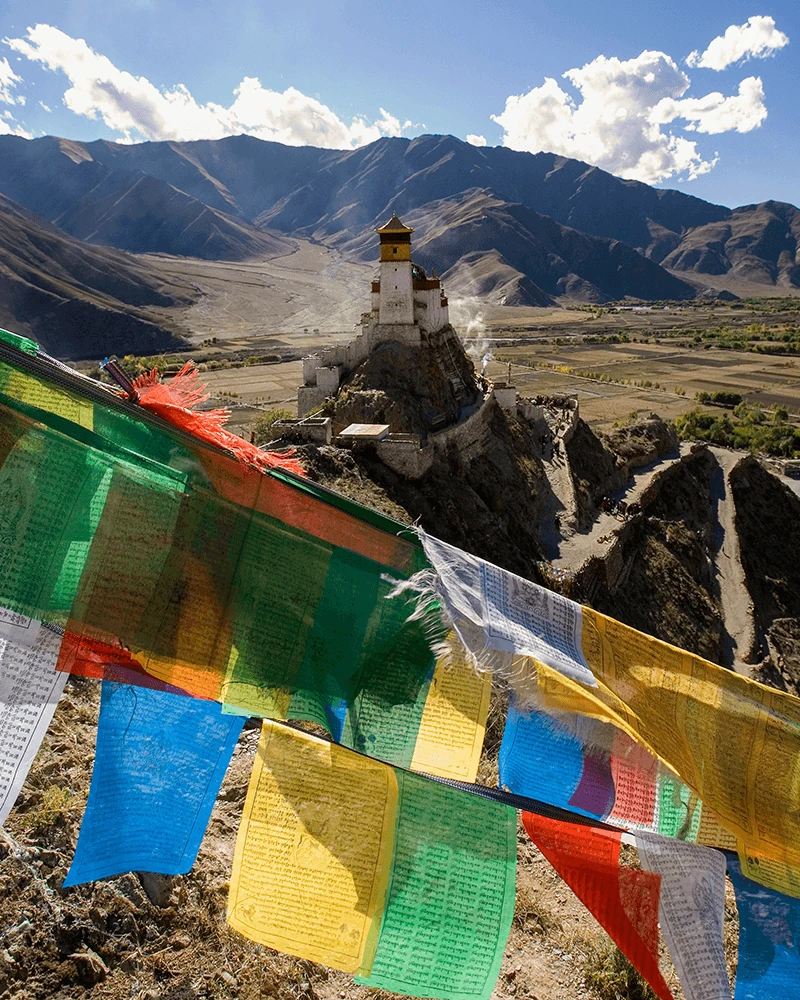 Prayer flags and stupa in the Tibetan mountains